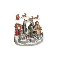 Karácsonyi jelenet falu gyermekfigurákkal, szánkóval